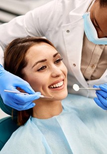 a patient undergoing a checkup from her dentist near Wethersfield