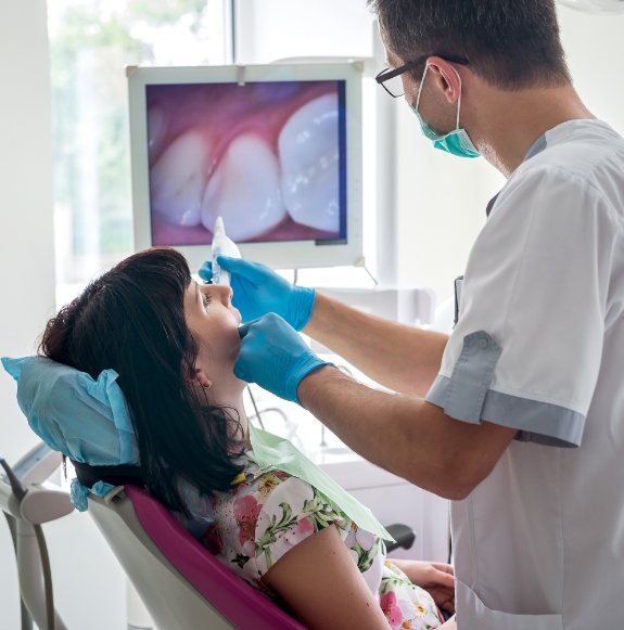 Hand holding a dental laser tool