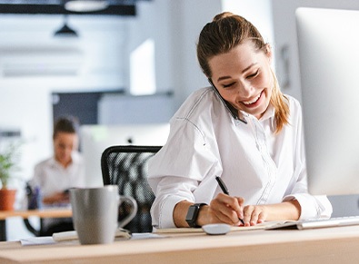 Woman smiling while working in office