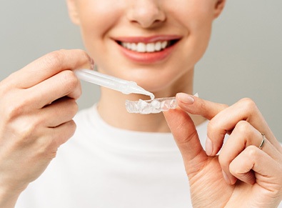 Person using professional take-home whitening kits