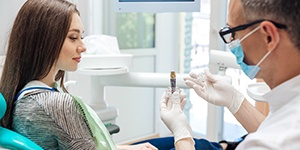 Woman sitting in dental chair during her consultation
