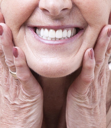 Closeup of woman smiling with dentures in Glastonbury