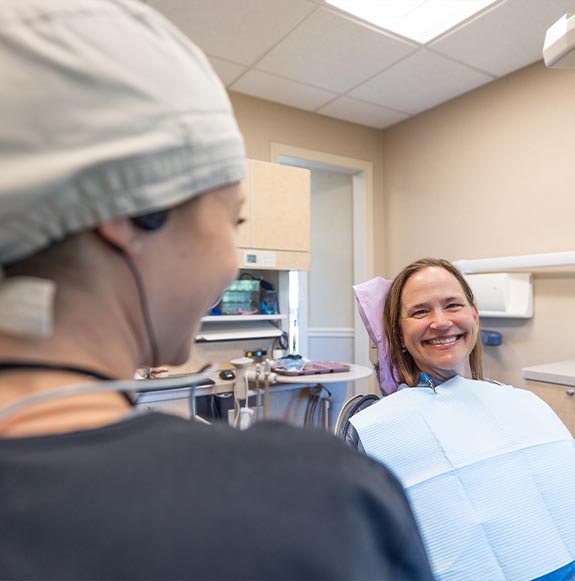 Closeup of woman smiling with dentures in Glastonbury