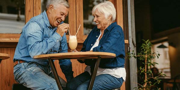 Senior couple with dentures in Glastonbury sharing a milkshake