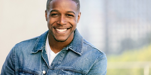 Male smiling with straight, white teeth
