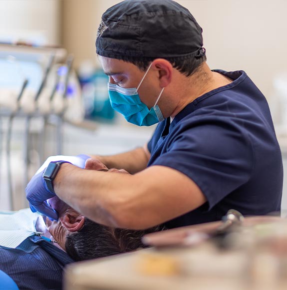 Man in pain holding jaw