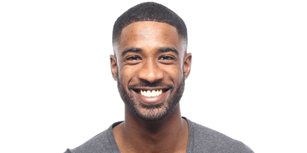 man in black shirt smiling after teeth whitening 