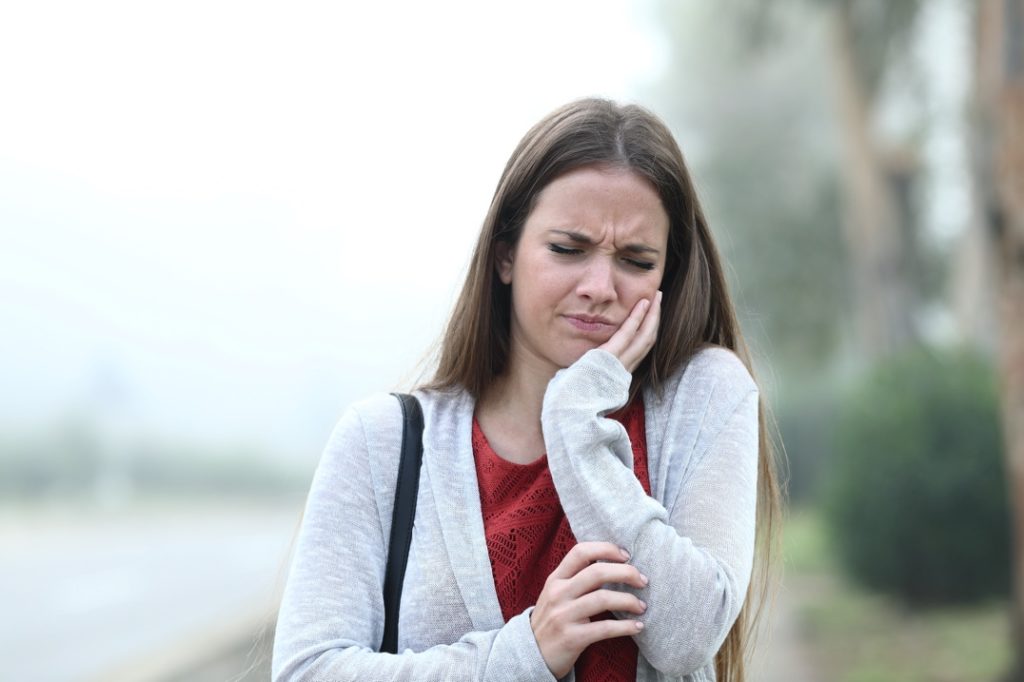 Woman with dental emergency