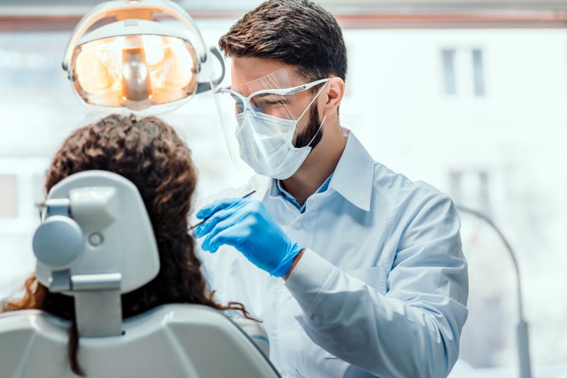 Dentist wearing PPE during routine appointment