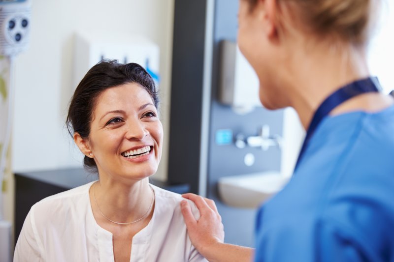 Dentist discussing dental implants with a patient