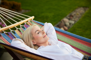 a woman napping in a hammock